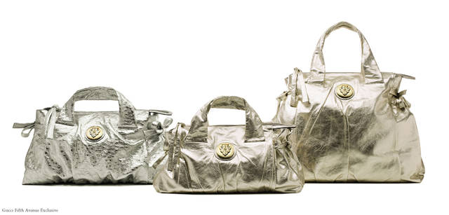 Hysteria Handbags | from left, super soft metallic platinum leather handbag and gold ostrich skin handbags These products are sold exclusively at Gucci Fifth Avenue store.