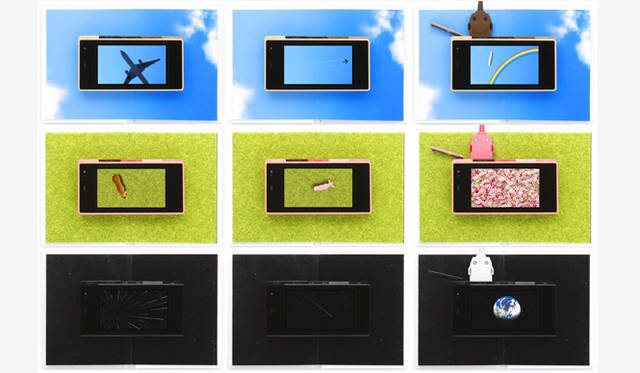 熊谷彰博｜ALEKOLE｜iida LIFESTYLE PRODUCTS「EHON TRAY」<br><br>「青空」「芝生」「宇宙」のFlashアニメをダウンロードし、「EHON TRAY」の上に携帯電話を置くと、液晶にてストーリーがはじまるというもの。