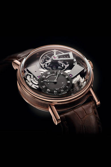 1775年の創業以来、つねに時計づくりの革新と密接に結びついてきたブレゲ。今年は、ナポリ王妃カロリーヌ・ミュラが複雑機構を備える腕時計をブレゲに注文してから、ちょうど200年。「クイーン・オブ・ネイプルズ」が誕生10周年を迎えることからも、節目の年にあたる。<br /><br />ムーブメントが露わになり、その機構を見渡すことができる時計「トラディション」。今年はあらたに、既存モデルの色ちがいや、GMT機能の搭載されたモデルが発表された。<br /><br />  <strong>トラディション 7047</strong><br /> 1816万5000円<br /> 手巻き、直径41mm、18KRG<br /><br />  ブレゲ ブティック銀座<br /> Tel.03-6254-7211