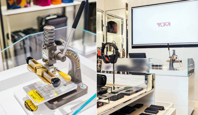 トゥミ南船場店<br />白のグラスウォールにはめ込まれた80インチのTVスクリーンでは、ブランドのシーズンキャンペーンをフィーチャーする