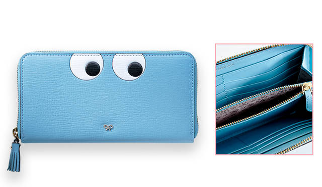 <strong>ANYA HINDMARCH｜アニヤ・ハインドマーチ<br /> 遊び心を溢れる愉快な日常を演出</strong><br /><br />  アニヤ・ハインドマーチの最新シリーズに長財布は、浮き彫りにしたお茶目な目玉のグラフィックスがモチーフ。大ぶりなラウンド ジップで開閉するタイプのウォレットの内部には、12枚のカードを収納できるスペースと、ふたつの紙幣用コンパートメントに仕切られ、収納力に申し分なし。遊び心溢れる旬のウォレットで日常のコーディネイトにプレーフルなアクセントを取り入れたい。<br /> <br /> [W19×H10×D3cm]5万6160円<br /> アニヤ・ハインドマーチ ジャパン Tel. 0800-800-9120