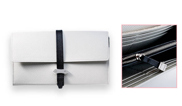 <strong>GLOBE-TROTTER｜グローブ・トロッター<br /> トランクのエッセンスを詰め込んだウォレット</strong><br /><br />  1年前にトランクケース以外のアクセサリーラインをはじめた英国ラグジュアリートブランド「グローブ・トロッター」からコンビカラーのウォレットが登場。アイボリーのベースカラーにネイビーのレザーストラップとライニングを組み合わせ、メンズライクで大人な色合いに完成した。トランクモチーフのジッパーヘッドや留め具など、ディテールにグローブ・トロッターの世界観を表現している。<br /> <br /> [W19×H9.5×D2cm]5万760円<br /> グローブ・トロッター ジャパン　Tel. 03-5464-5248