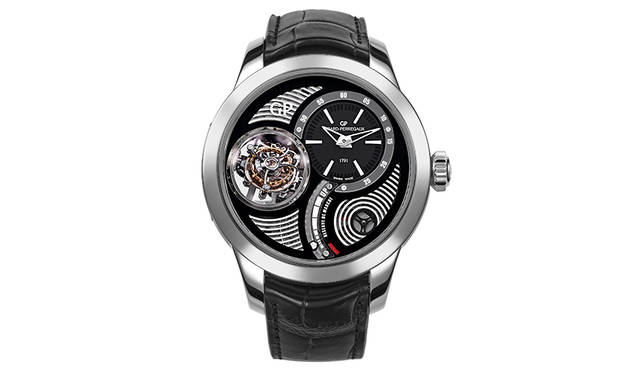 <strong>トライアクシャル トゥールビヨン</strong><br />  1分間で1回転、30秒で1回転、2分間で1回転の3軸を組み合わせて、3次元の姿勢差を補正するトゥールビヨンを搭載。文字盤の右下には、パワーリザーブインジケーターを装備する。3977万円（チタン。税別）。