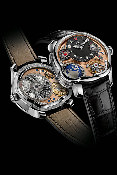 シースルー仕様の両面から覗くムーブメントの表面を、18Kピンクゴールドで美しくコーティング。<br/><br/><strong>GMT ムーブメント5N</strong><br/>ケース｜ケース｜プラチナ<br/>直径｜43.5mm<br/>厚さ｜16.14mm<br/>ムーブメント｜手巻き（Cal.GF05）、ピンクゴールドPVD<br/>機能｜トゥールビヨン（24秒周期）、パワーリザーブ表示、第２時間帯表示（時分表示横の小表示および左下の地球儀）、ワールドタイム表示（夏冬時間表示・裏ブタ側）<br/>ストラップ｜アリゲーター<br/>防水性｜３気圧<br/>限定数｜22本<br/>発売時期｜2015年秋<br/><br/>ヴィタエルーキス<br/>Tel. 03-6421-7533<br/>http://www.greubelforsey.ch/<br/>info@vitaelucis.com<br/>