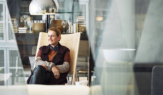 Patricia sitting on her favorite personal chair from Gio Ponti Collection by Molteni&C.