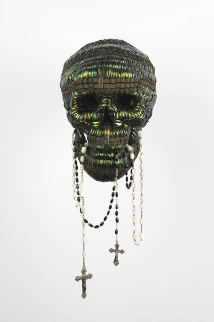 SKULL WITH THE TOOL OF POWER<br />Photographer : Lieven Herreman<br />Copyright : Angelos bvba