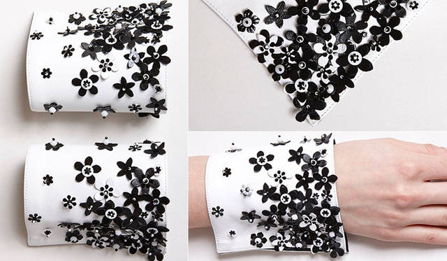 <strong>TOYO KITCHEN STYLE｜トーヨーキッチンスタイル</strong><br />シャツカフ（付け袖）ブランド「Catherine Osti（キャサリン・オスティ）」　クチュール コレクション「White leather with flowers（ホワイト レザー ウィズ フラワーズ）」は、オートクチュールに携わるアトリエ“Cécile Henri（セリーヌ アンリ）”の職人によって、白と黒のレザーの繊細な花とビジューがほどこされたラムスキンのレザーカフス。21万6000円