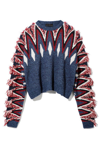 フリンジディテールでアレンジしたドロップショルダーのクルーネックニット。インパクトのあるカラーでトライバル柄を大胆に取り入れて。ニット3万9000円（ディーゼル ブラック ゴールド）